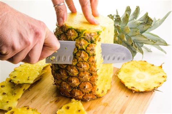 How To Cut a Pineapple Without a Knife 2023| Well+Good